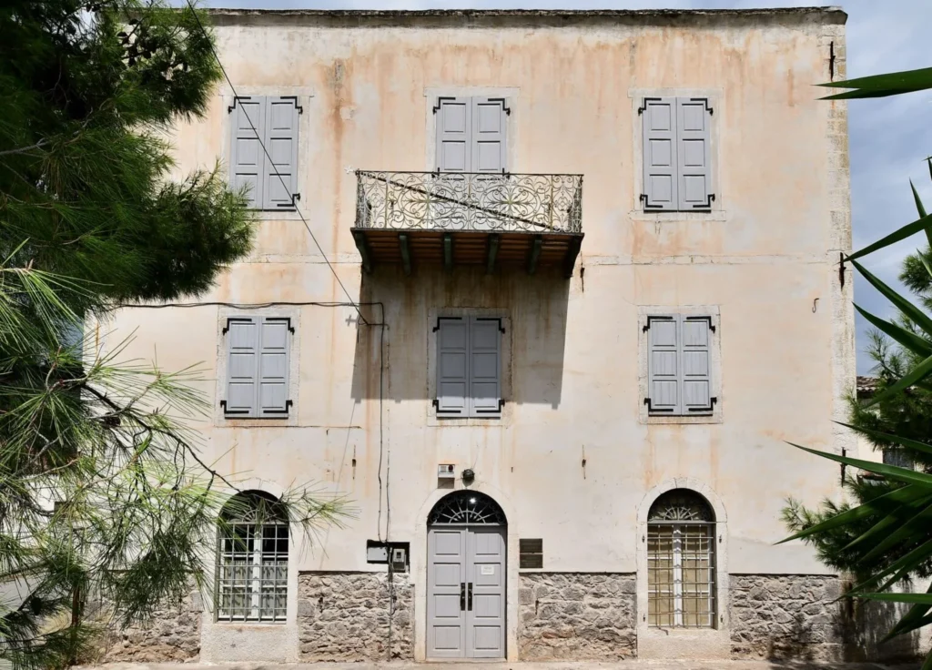 Angeléiko mansion in Galaxidi, with stone façade, balconies and ornate iron railings