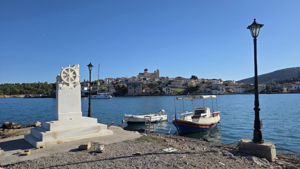 The Monument to the Unknown Sailor at Carnagio, Chirolakas harbour, Galaxidi, with a marble ship's wheel