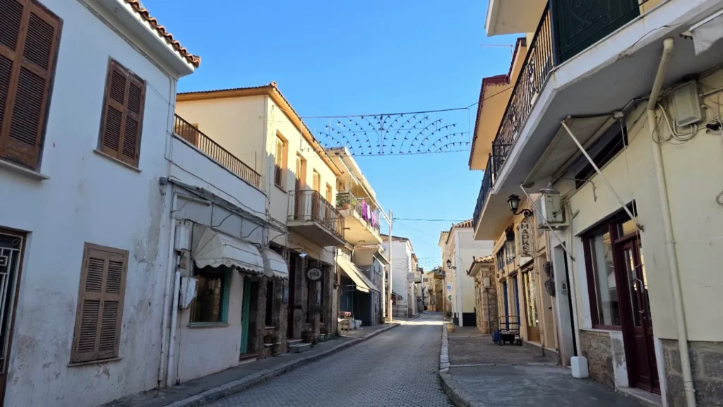 Traditional Galaxidi street with shuttered houses and balconies