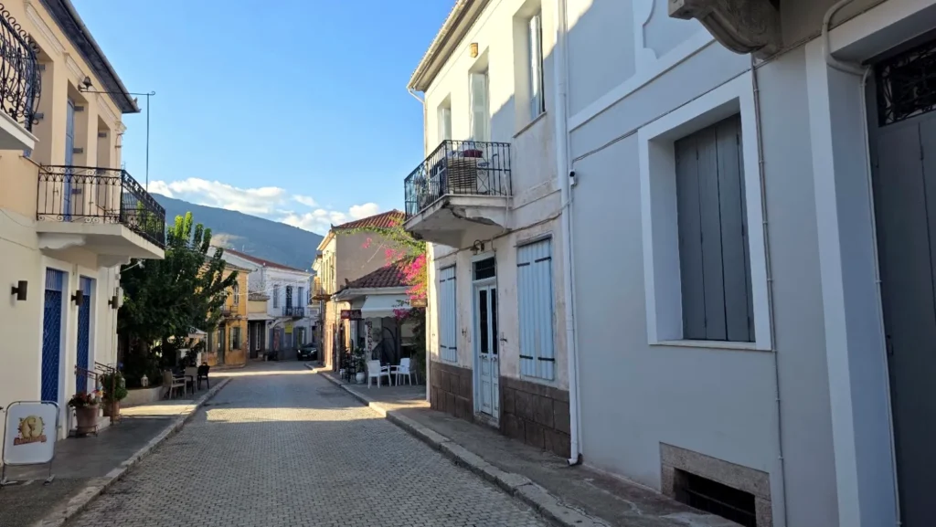 Traditional houses and balconies lining a Galaxidi street