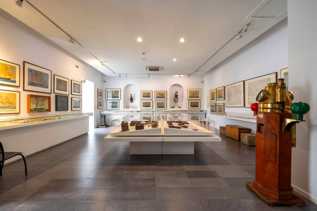 Exhibition gallery containing historic ship paintings at Galaxidi's maritime museum
