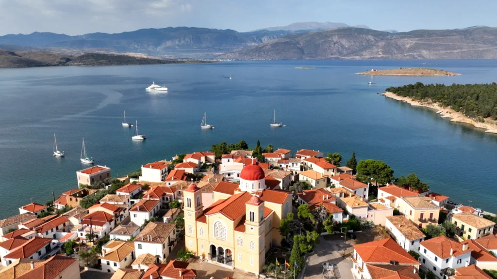 Aerial view of Agios Nikolaos Church in Galaxidi with its red dome and bell towers