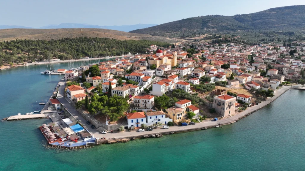 Aerial view of Galaxidi, Greece, with red-roofed houses, Agios Nikolaos Church and the waterfront