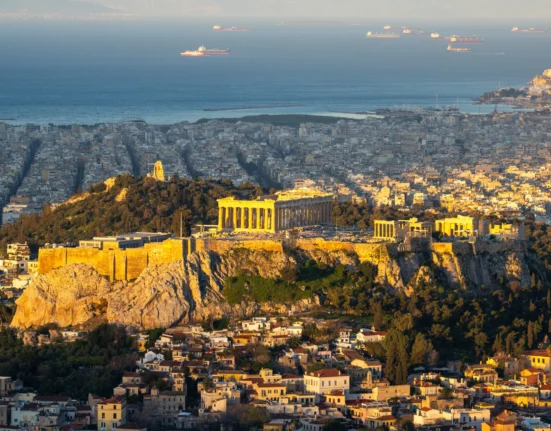 Panoramic view of Athens with the Acropolis and Saronic Gulf in the background