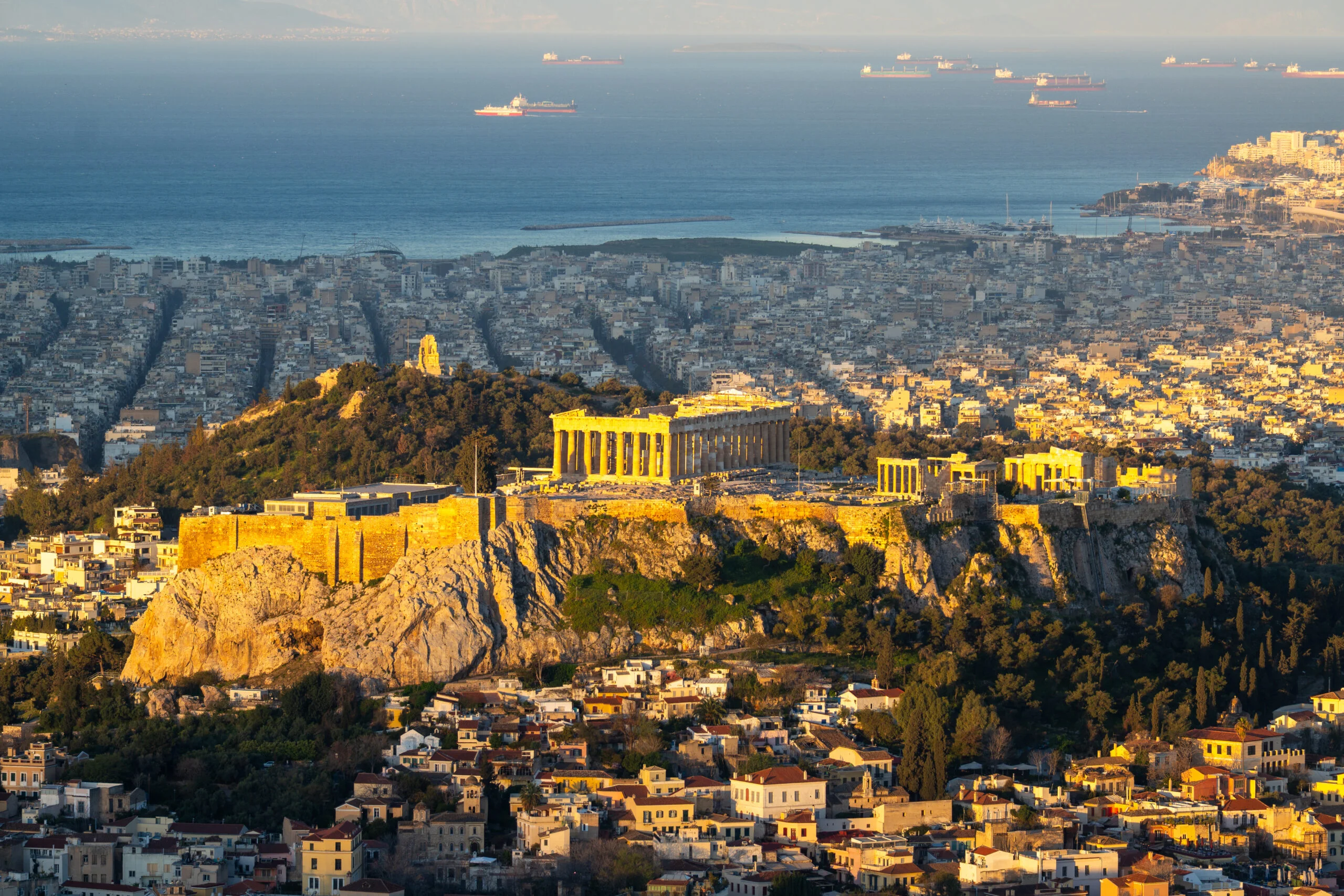 Panoramic view of Athens with the Acropolis and Saronic Gulf in the background