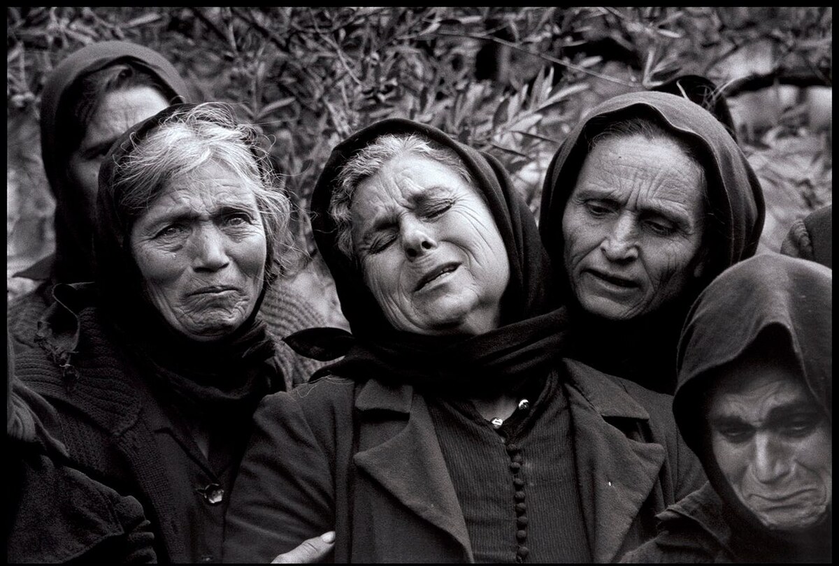 Women performing moirologia beside a grave in Mani, Greece, in 1962, Intangible Cultural Heritage in Greece