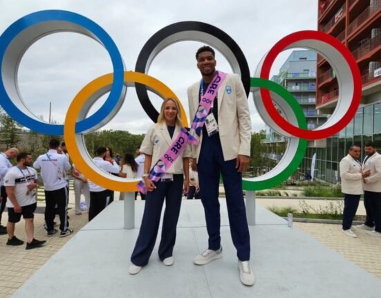 Giannis Antetokounmpo and Antigoni Drisbioti proudly represented Greece as flag bearers for the 2024 Olympic Games in Paris. Photo Creidit: Hellenic Olympic Committee via LinkedIn