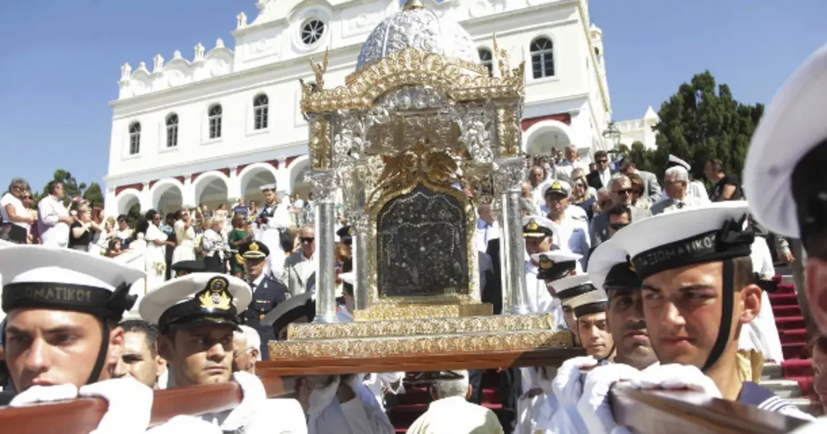 Hellenic Navy officers carry the holy icon of the Virgin Mary during the August 15 procession in Tinos