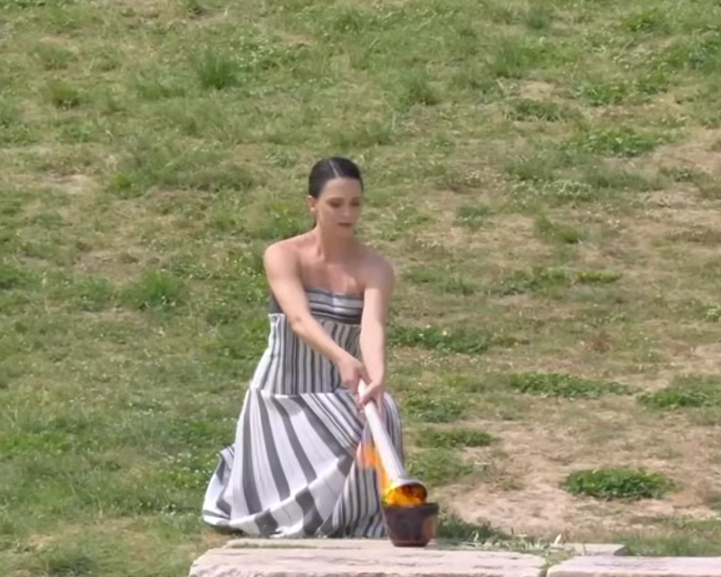 Greek actress Mary Mina, playing the role of High Priestess, lights the flame during the Olympic Flame lighting ceremony for the Paris 2024 Olympics, Ancient Olympia, Greece.