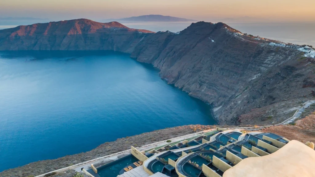 Aerial view of Andronis Concept and its pools overlooking Santorini’s caldera