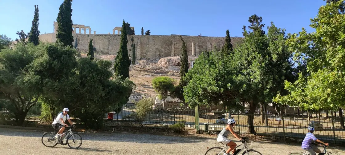Cyclists below the Acropolis in Athens, Greece