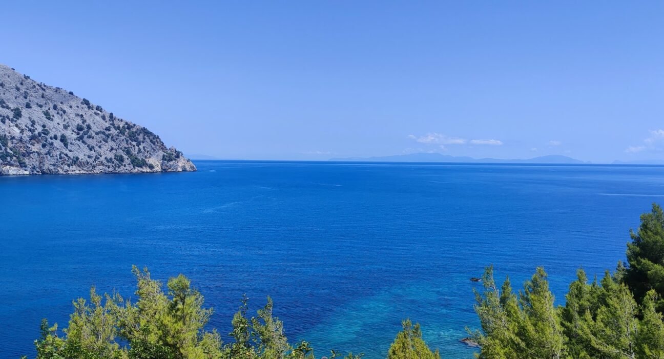 Evia Greece Evia, Greece. Deep blue water, clear sky and rocky coastline