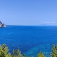 Evia Greece Evia, Greece. Deep blue water, clear sky and rocky coastline