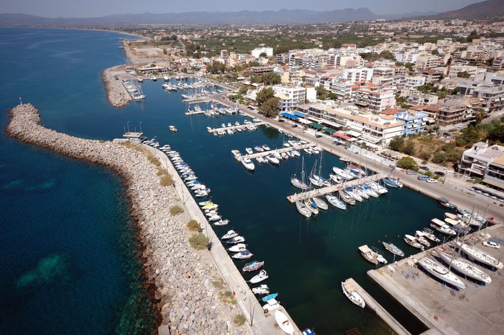 Aerial view of Kalamata marina, coastline, city buildings and the Messinian Bay.