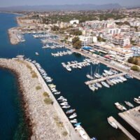 Aerial view of Kalamata marina, coastline, city buildings and the Messinian Bay.