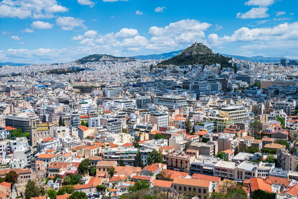 Panoramic view of modern Athens with Lycabettus Hill rising above the city skyline.