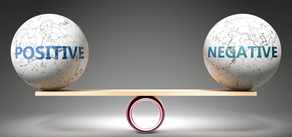 Positive and negative in balance - pictured as balanced balls