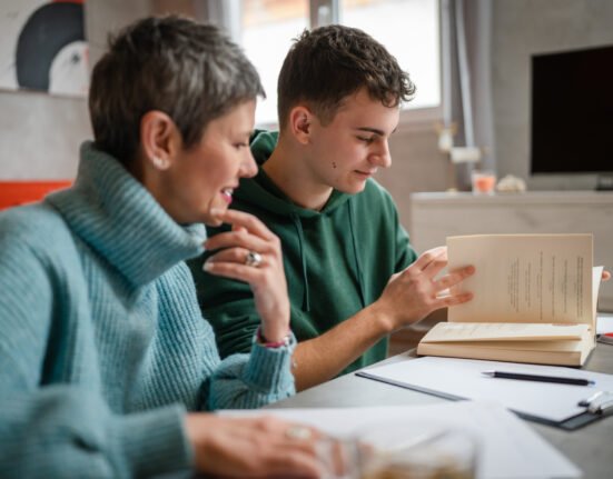Teenager studying with a private tutor in Greece, representing tutoring culture, international school pressure and university preparation.