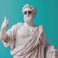 Ancient Greek philosopher statue wearing sunglasses, symbolising Greek culture and communication.