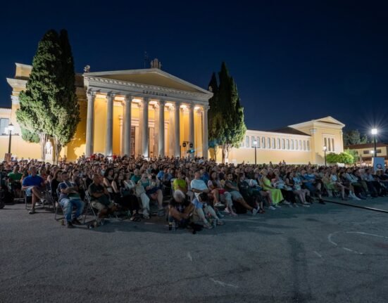 People attending an Athens Open Air Film Festival screening in front of Zappeion, Athens.