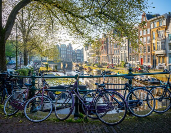 Bicycles beside a canal in Amsterdam, the Netherlands