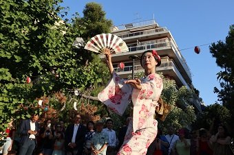Japanese dancer with a fan performing during a previous Natsu Matsuri celebration at the Japanese Park of Athens.