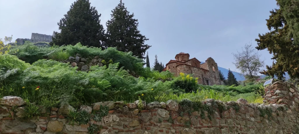 Ruined buildings spread across the steep hillside at Mystras