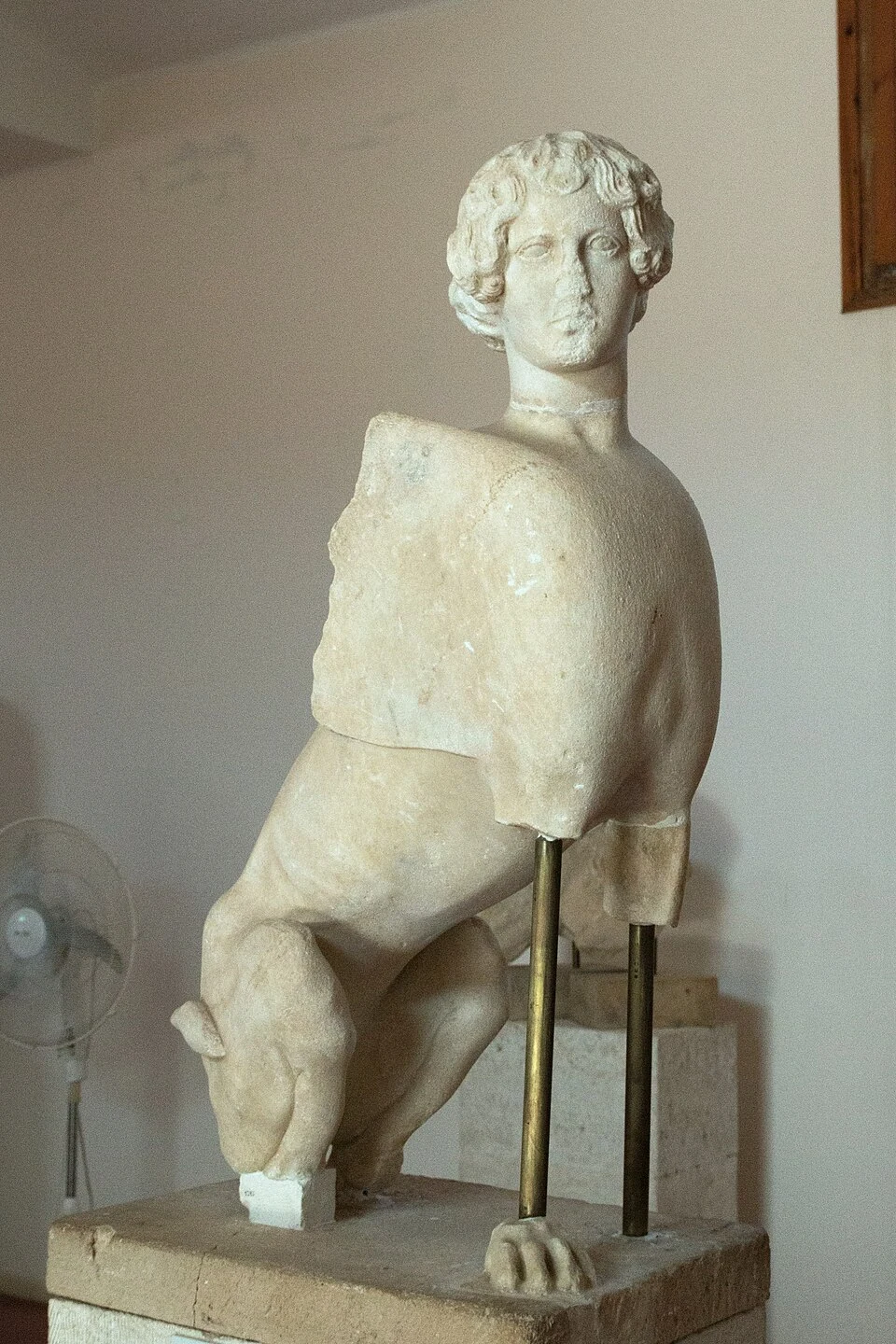 Early Classical marble sphinx from the Temple of Apollo at Kolona, displayed at the Archaeological Museum of Aegina.