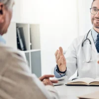 Doctor speaking with a patient during a private medical consultation in Greece