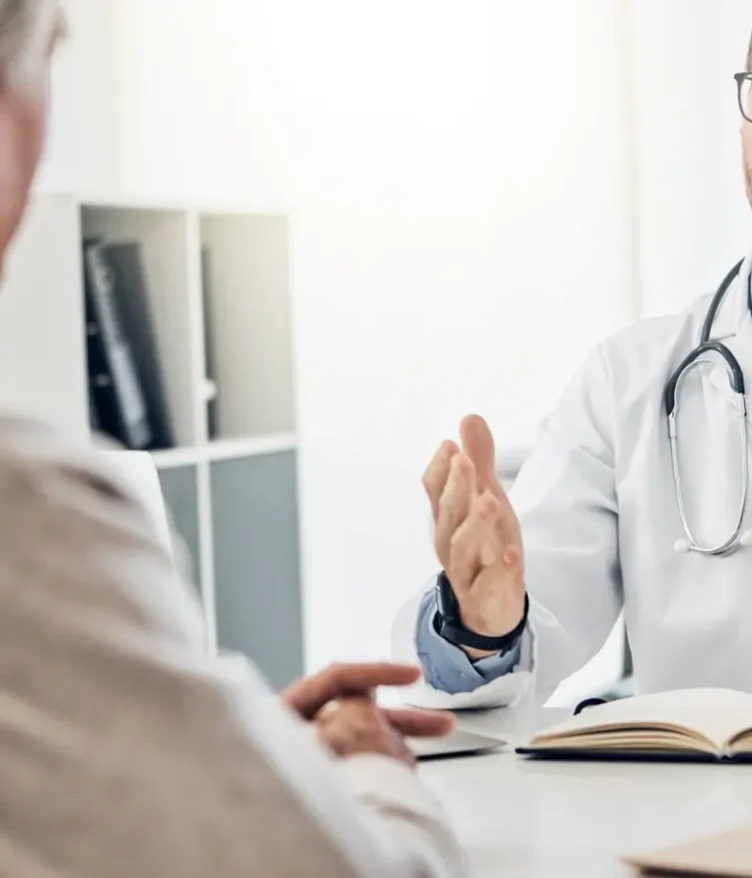 Doctor speaking with a patient during a private medical consultation in Greece
