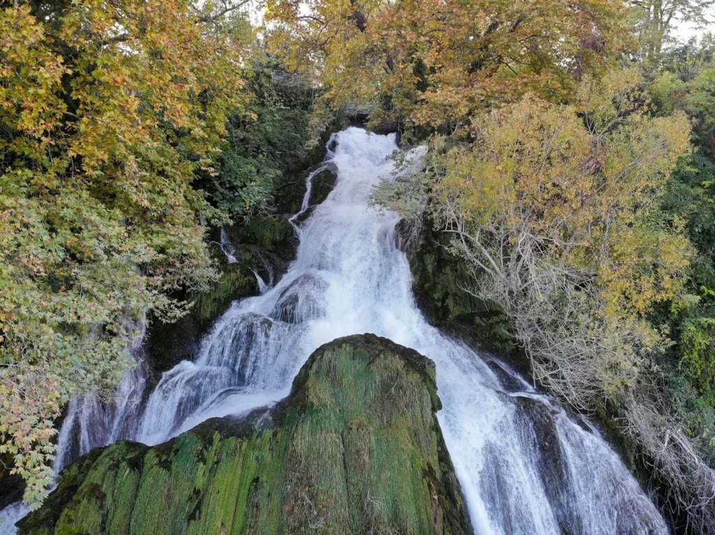 Double Waterfall or Lambda surrounded by trees in Edessa Waterfall Park