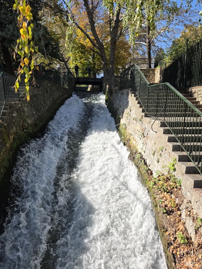 Fast-flowing water channel at the Open-Air Water Museum in Edessa