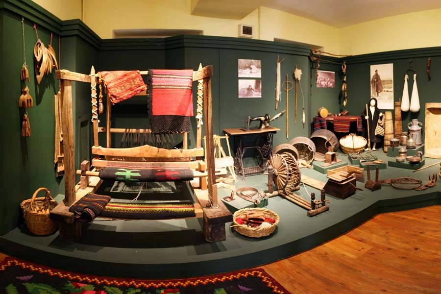 Traditional weaving loom and household objects inside the Folklore Museum of Edessa in Varosi