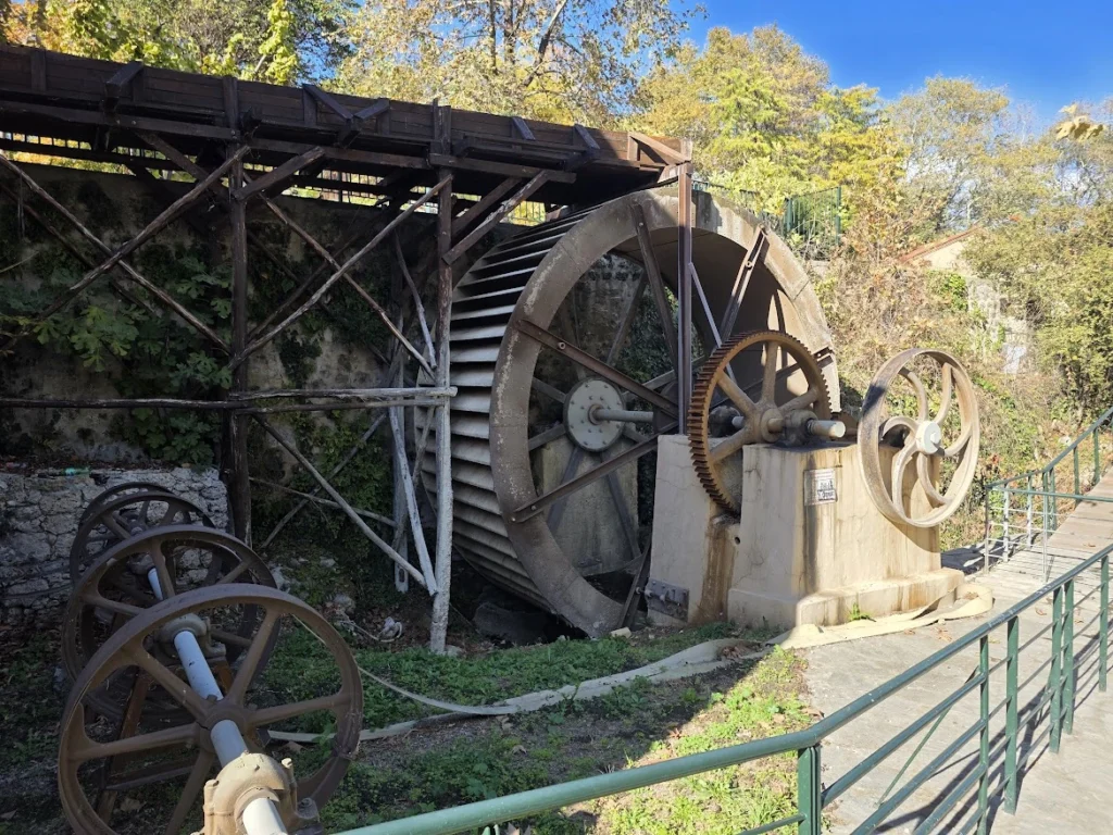Large historic water-powered machinery at the Open-Air Water Museum of Edessa
