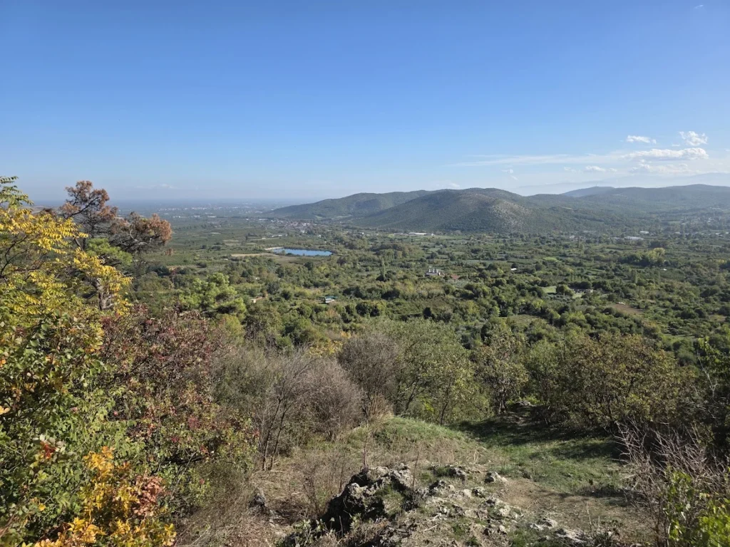 View across Longos and the Macedonian plain from the lower viewing level beneath Karanos Waterfall