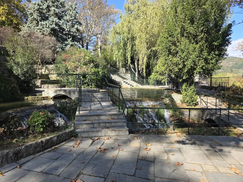 Walking paths, trees and water channels inside Edessa Waterfall Park