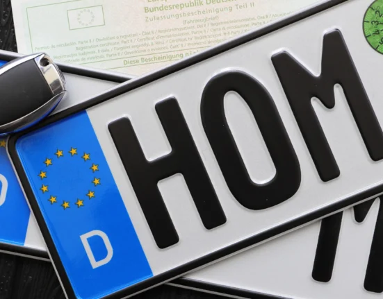 Foreign vehicle registration plates with a car key and documents, illustrating foreign-registered car rules in Greece.