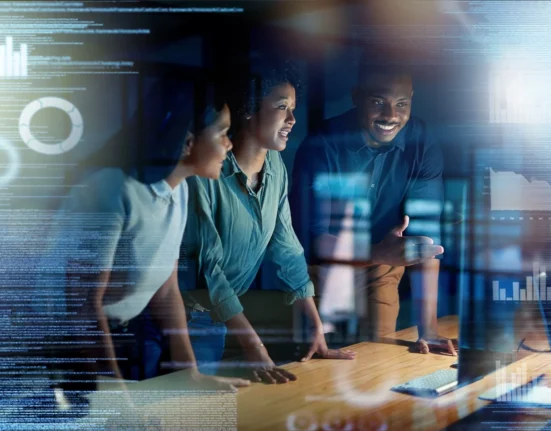 International technology professionals collaborating in a modern workplace