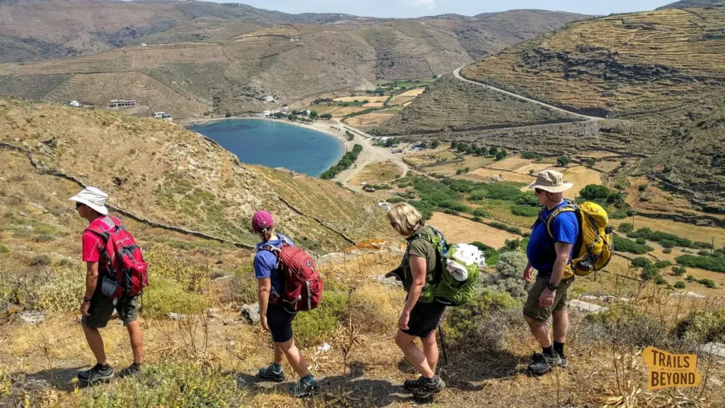 Hikers following a coastal trail during an active holiday on Kythnos island.
