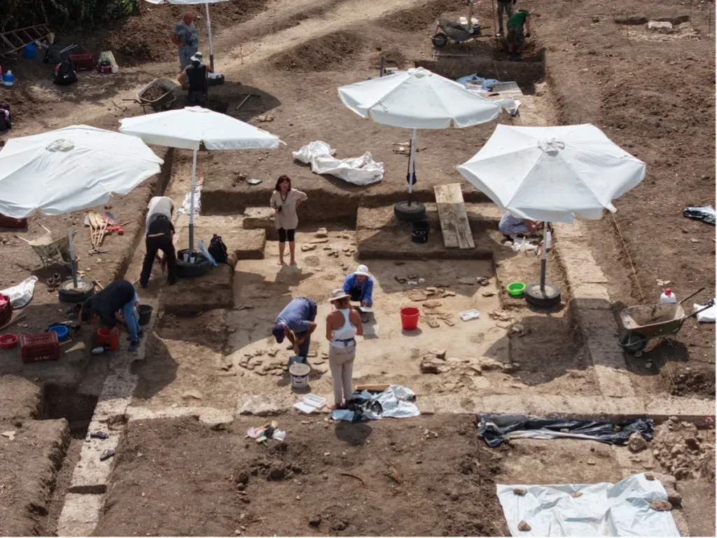 Archaeologists working in the northern banqueting room at the Royal Gymnasium of ancient Mieza.