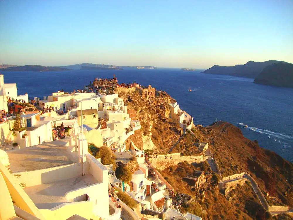 Sunset over the whitewashed village of Oia in Santorini