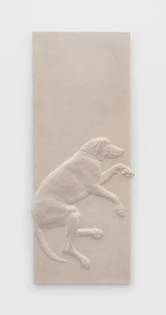 Rachel Feinstein’s Red, a pale sculptural relief depicting a dog lying on a slab.