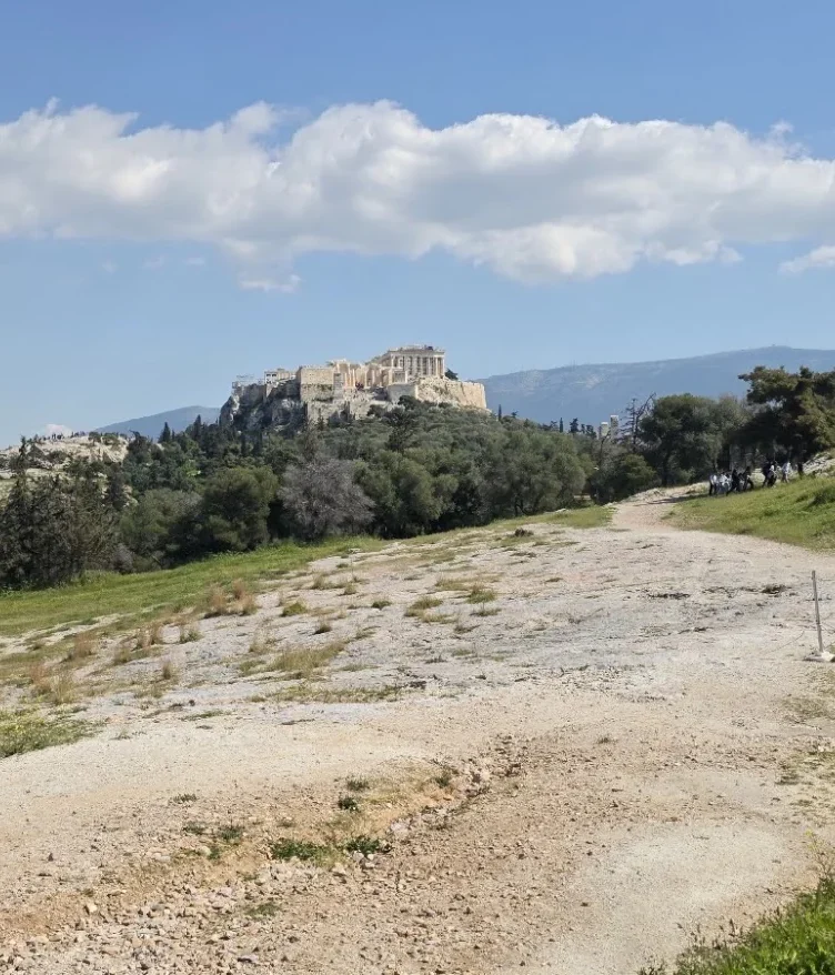 he ancient Pnyx assembly ground in Athens, with the Acropolis and Parthenon in the background.