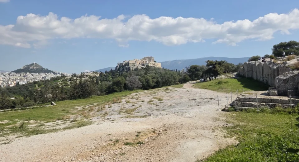 he ancient Pnyx assembly ground in Athens, with the Acropolis and Parthenon in the background.