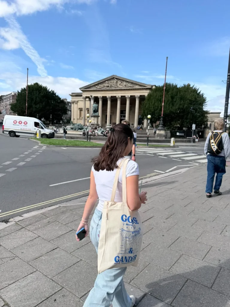 Student walking towards a university building