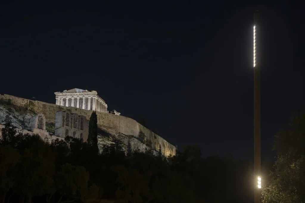 New lighting pole beside Athens’ historic promenade with the illuminated Parthenon above