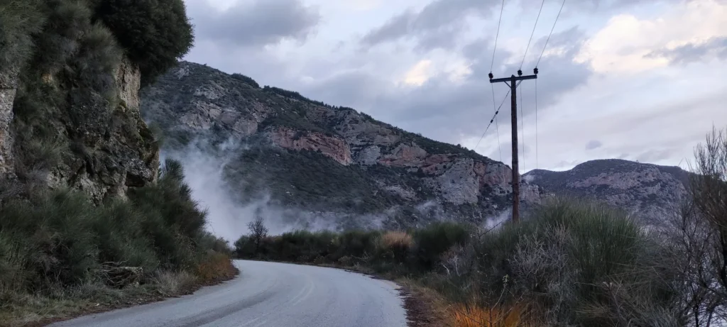 Mountain road through mist in Feneos
