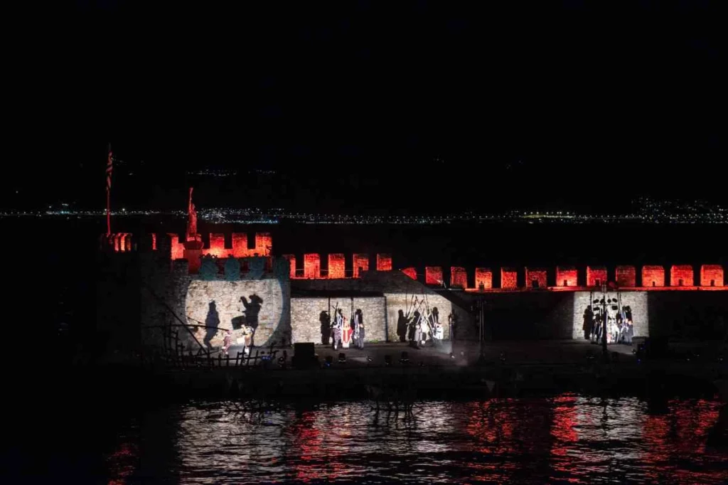 Floodlit Venetian harbour walls in Nafpaktos during the 2025 Battle of Lepanto commemoration